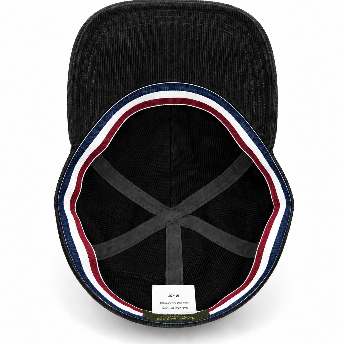 Black French corduroy cap interior with matching striped band and labels